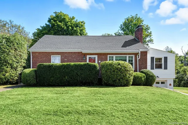 a view of a house with a garden