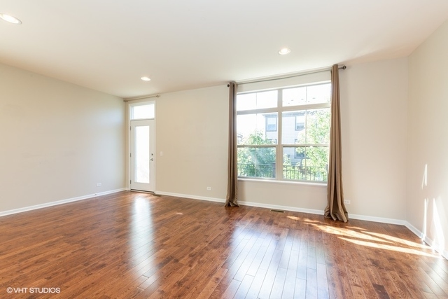 323 Aspen Pointe Road Vernon Hills, IL 60061 - Photo 6 of 12 an empty room with wooden floor and windows