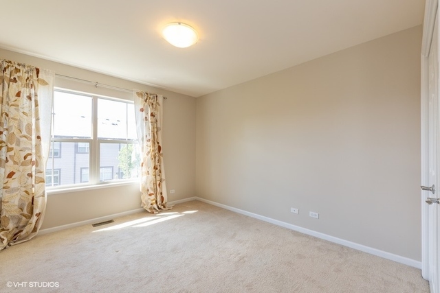 323 Aspen Pointe Road Vernon Hills, IL 60061 - Photo 10 of 12 an empty room with a window