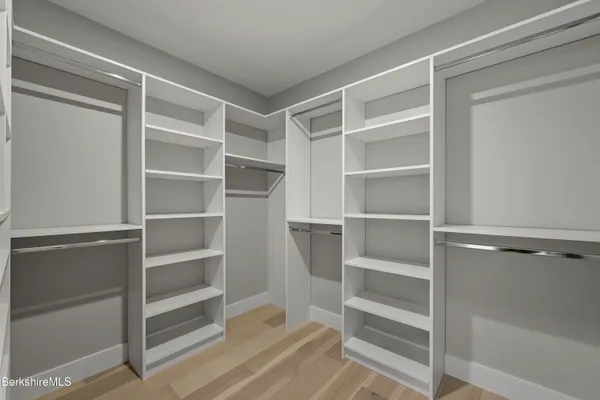 a bedroom with a bed couch and window