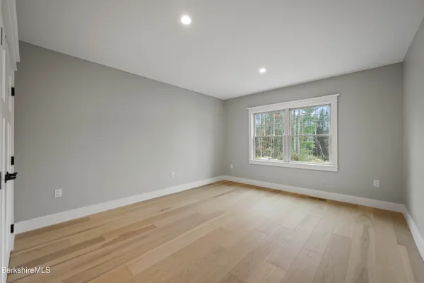 a spacious bedroom with a bed and a couch