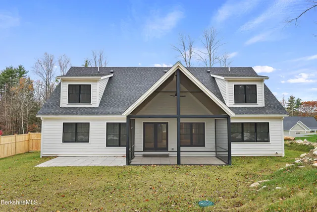 a view of swimming pool with an outdoor space and seating area
