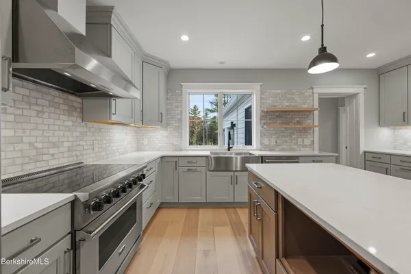 a bedroom with double bed and a couch