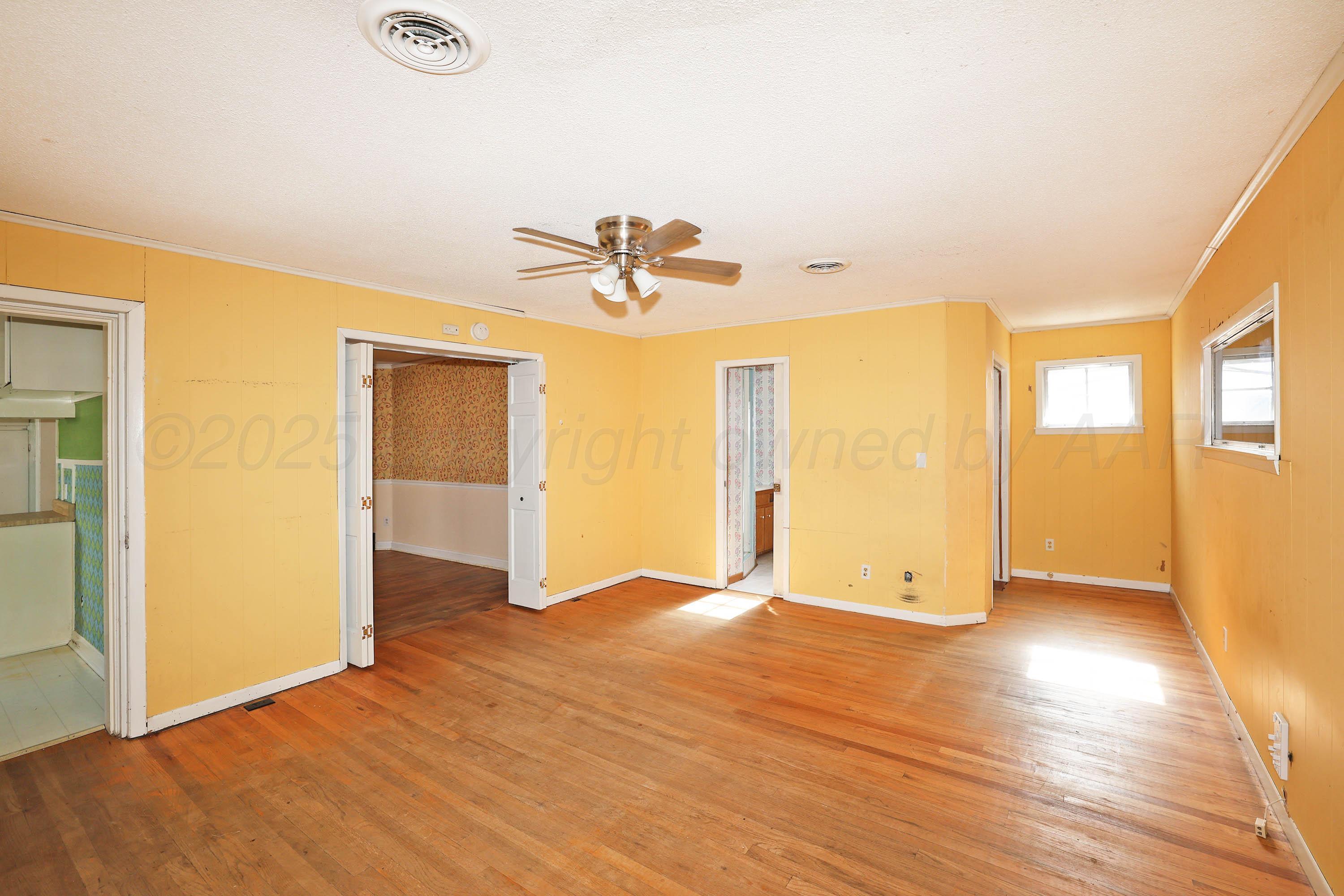 1528 South Lipscomb Street Amarillo, TX 79102 - Photo 15 of 24 wooden floor in an empty room with a window