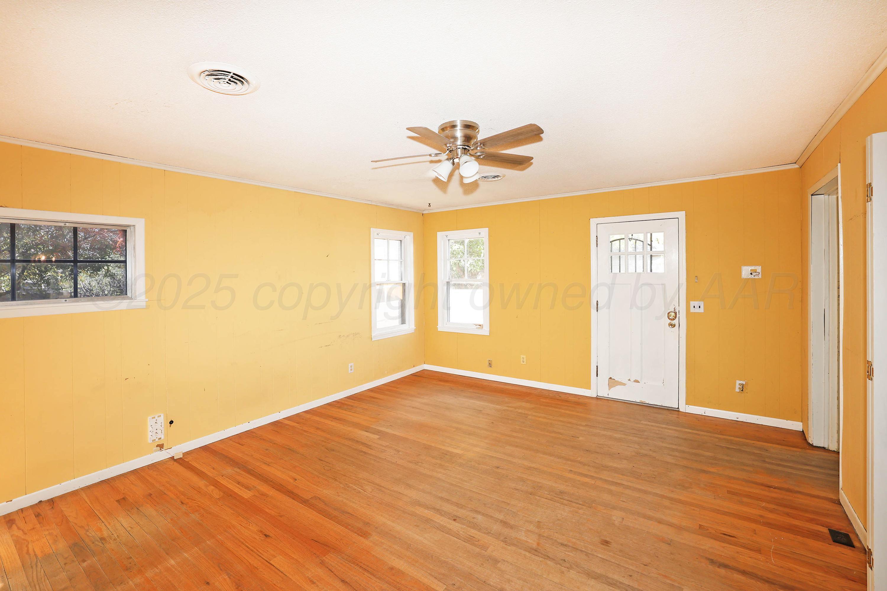 1528 South Lipscomb Street Amarillo, TX 79102 - Photo 16 of 24 a view of a room with a window and a ceiling fan