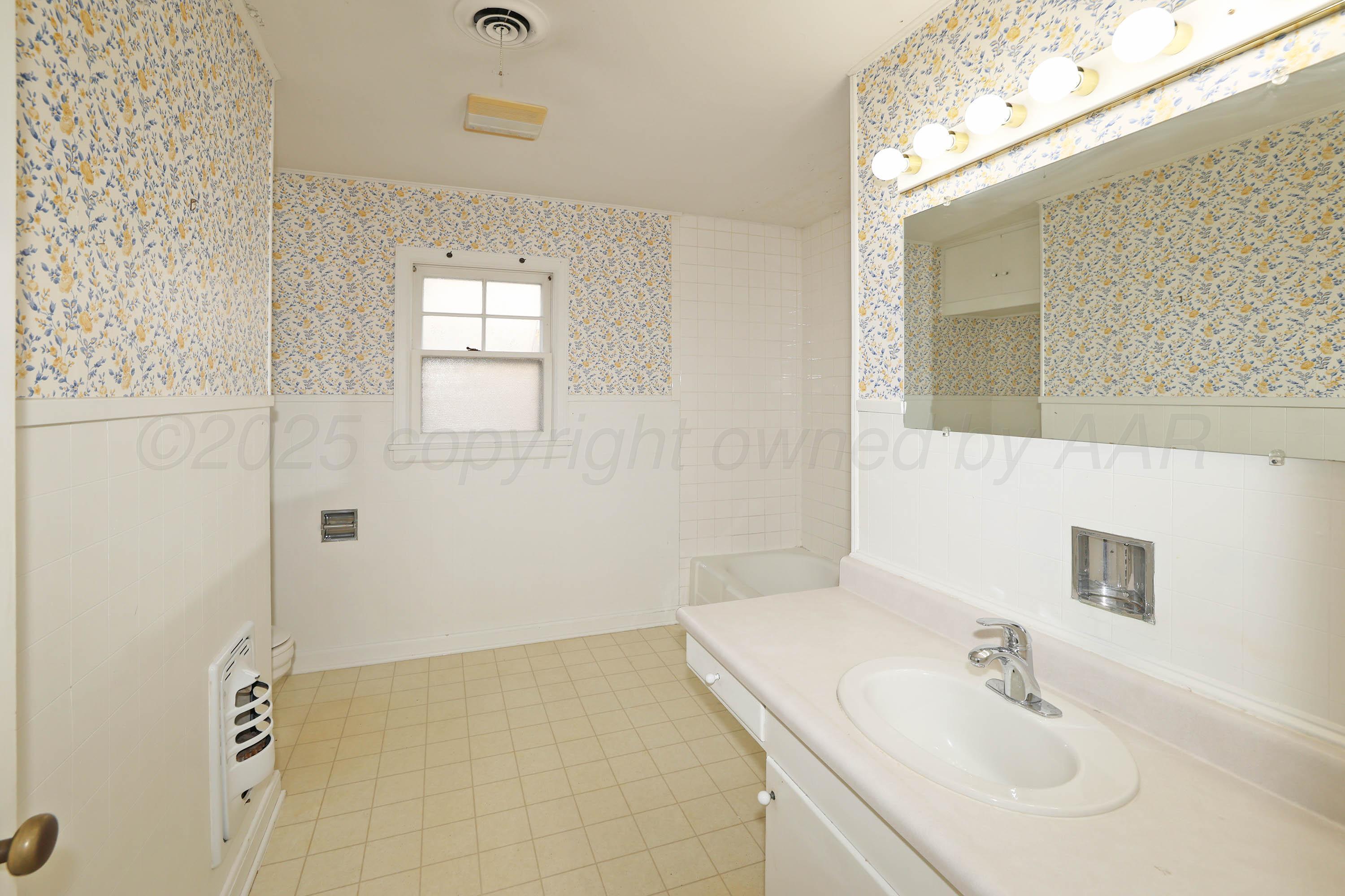 1528 South Lipscomb Street Amarillo, TX 79102 - Photo 22 of 24 a bathroom with a sink a shower and a mirror