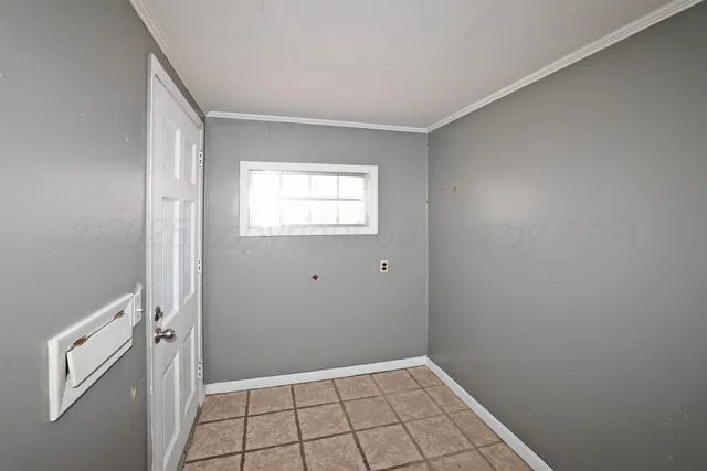 a view of an empty room with closet area