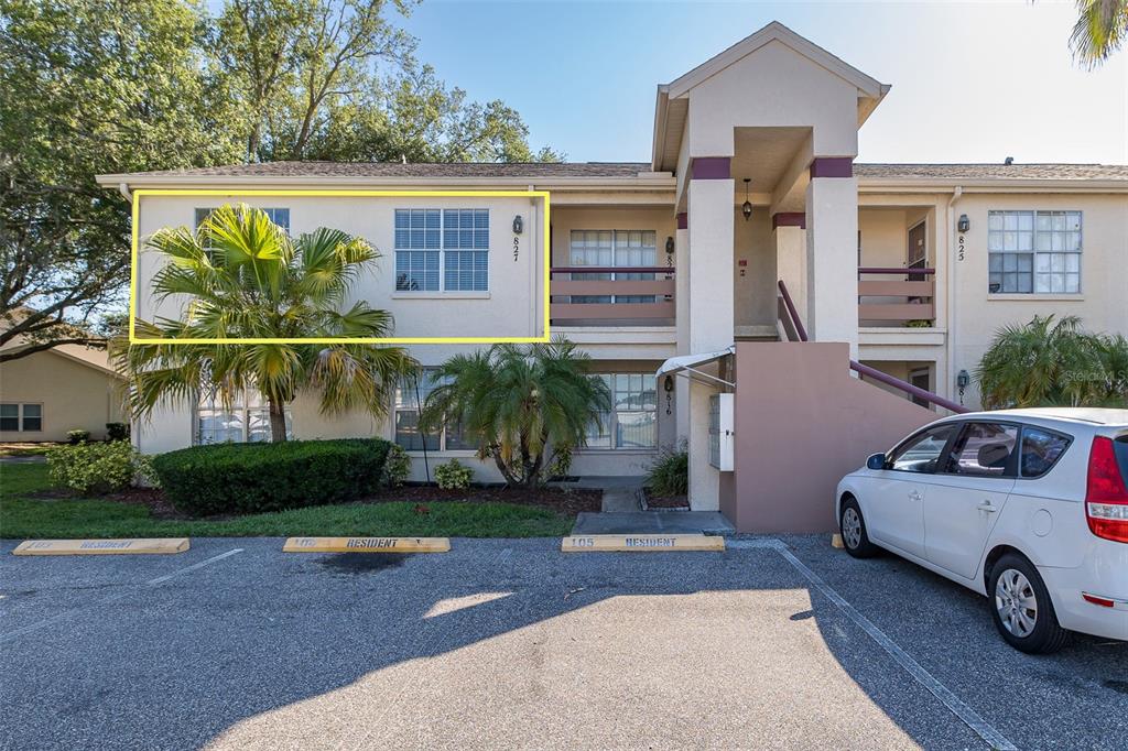 7900 Hardwick Drive, Unit 827 New Port Richey, FL 34653 - Photo 2 of 27 a view of a car park in front of house