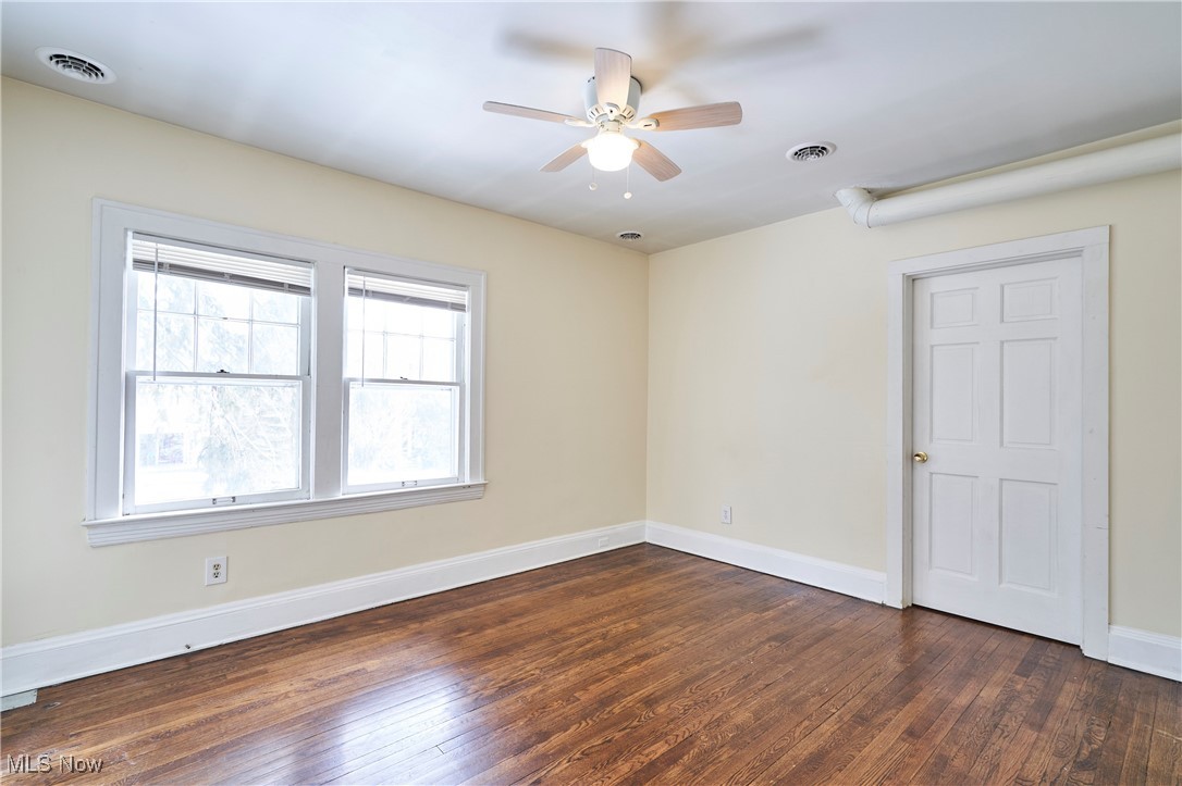 2152 Middlefield Road Cleveland, OH 44106 - Photo 17 of 50 Spare room with dark hardwood / wood-style floors and ceiling fan