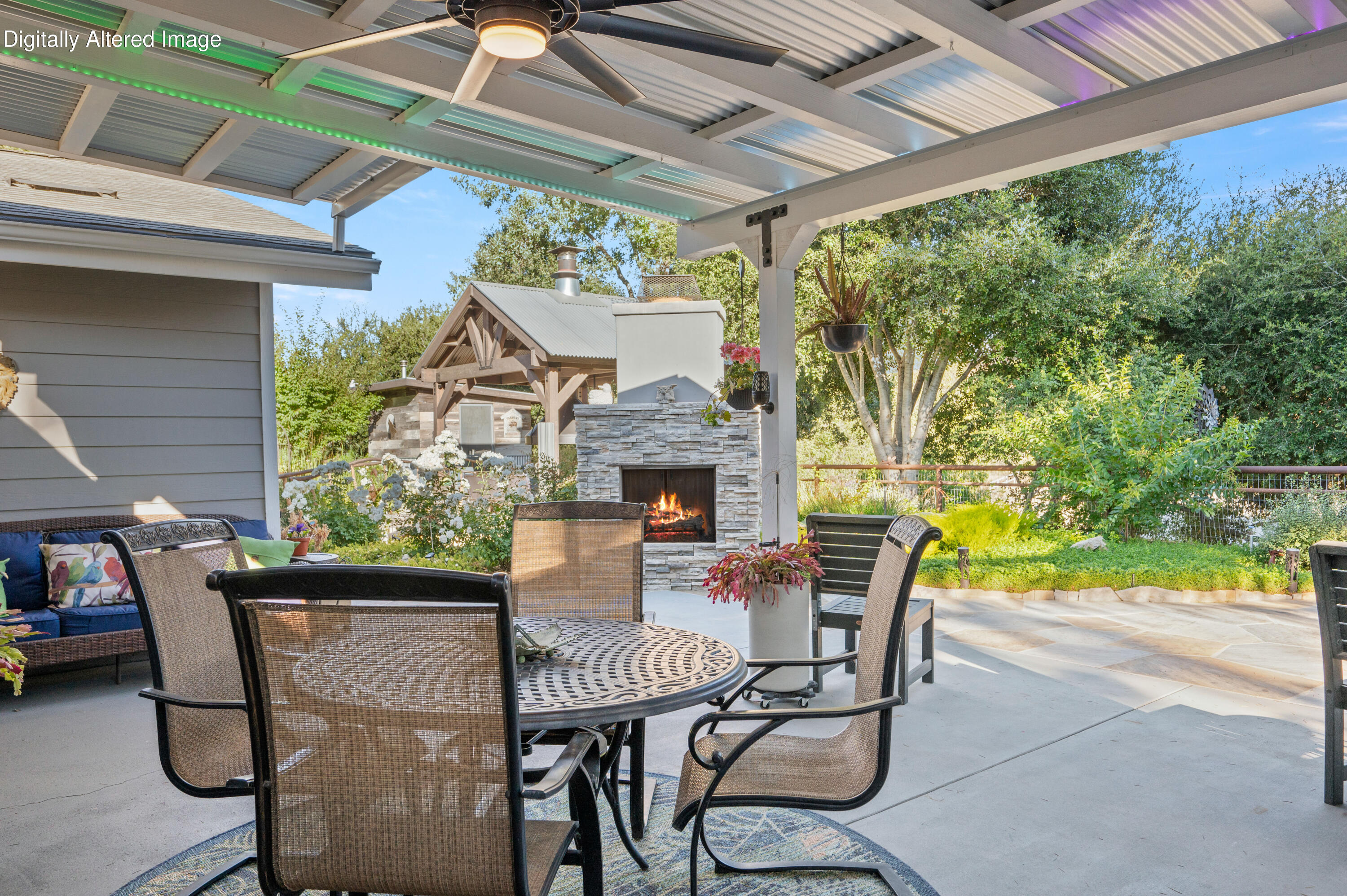 2550 Elk Grove Road Solvang, CA 93463 - Photo 32 of 74 a patio with table and chairs and potted plants