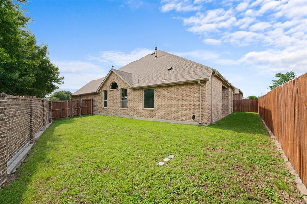 600 Fishback Circle Plano, TX 75074 - Photo 35 of 38 a view of a backyard with barn and wooden fence