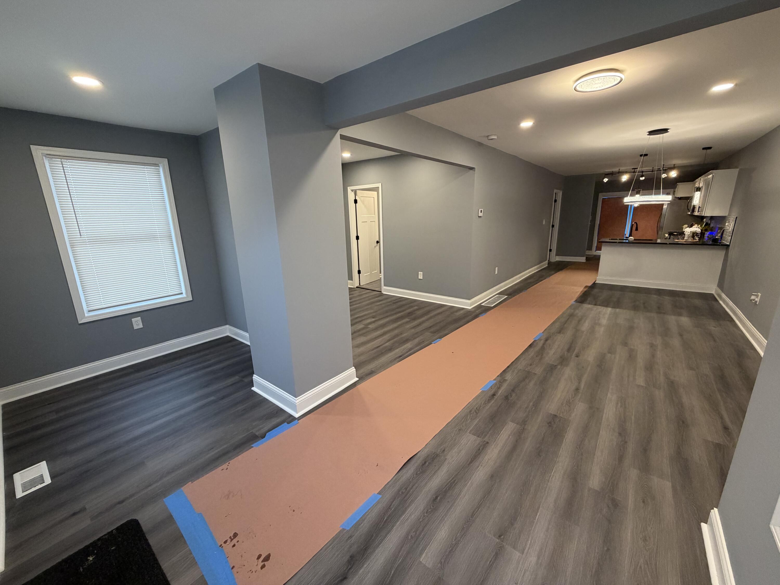 2425 Adams Street Gary, IN 46407 - Photo 3 of 26 a view of an empty room with wooden floor