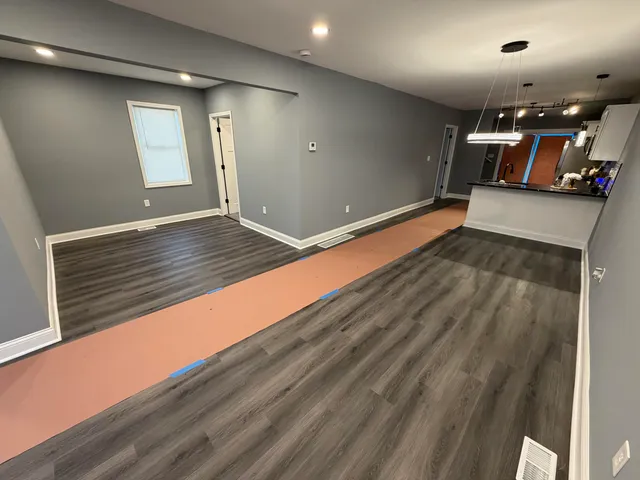 a view of a hallway with stairs