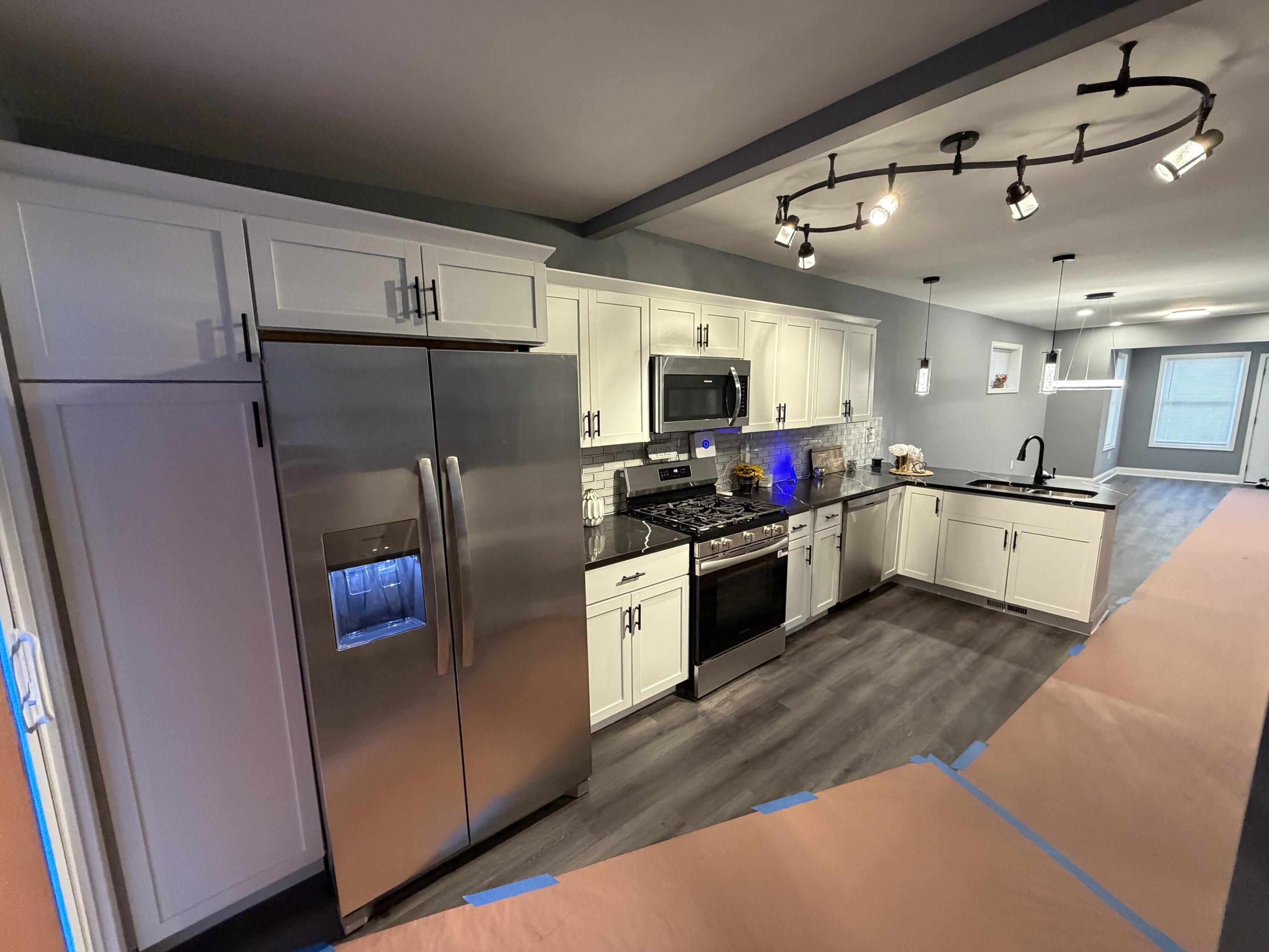 2425 Adams Street Gary, IN 46407 - Photo 9 of 26 a kitchen with stainless steel appliances a refrigerator sink and microwave