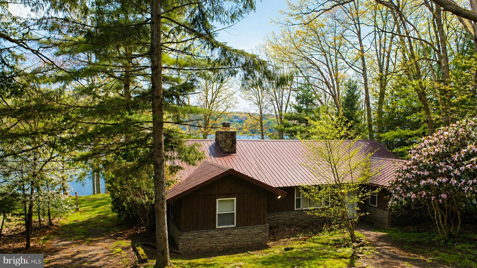 2187 State Park Road Swanton, MD 21561 - Photo 21 of 29 a front view of a house with garden