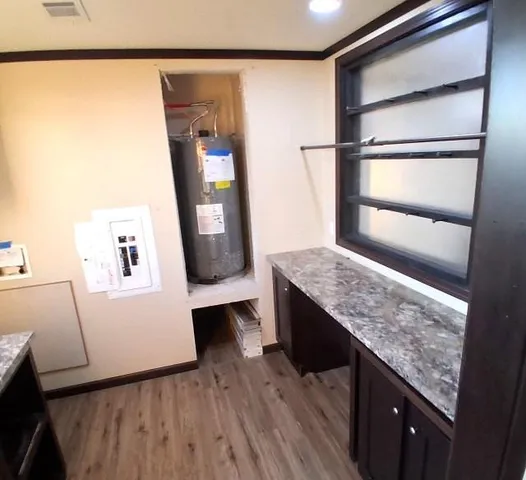 a living room with granite countertop furniture and a fireplace
