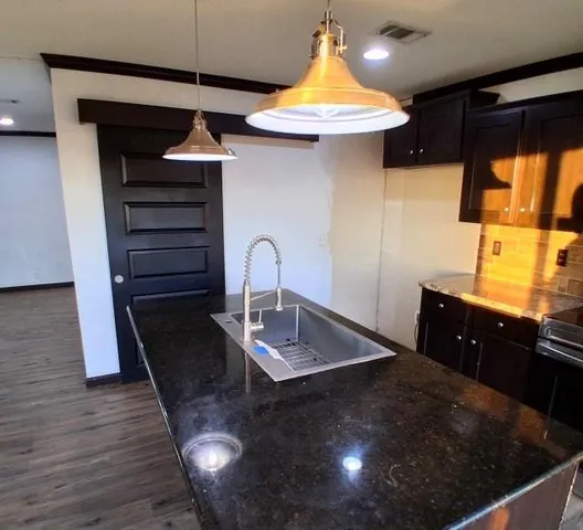 a kitchen with a table and a sink