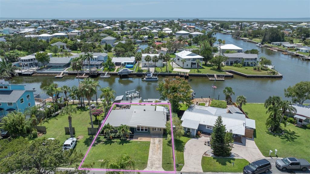 an aerial view of a house with a lake view