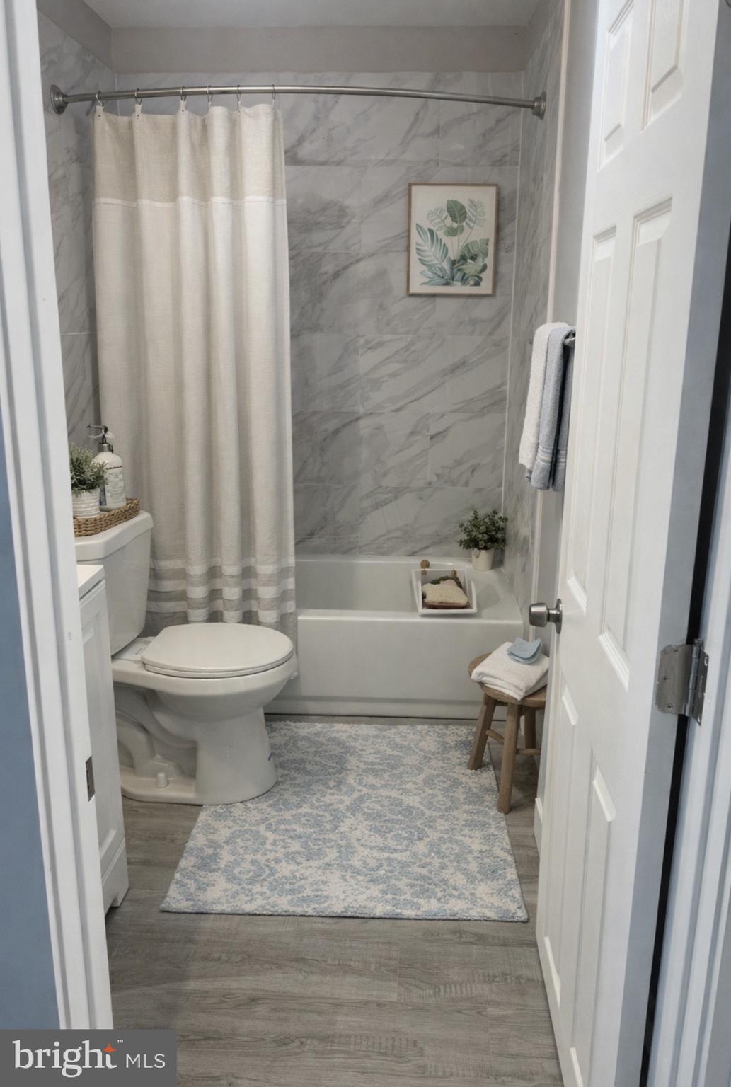 3137 Arbor Street Philadelphia, PA 19134 - Photo 13 of 17 a bathroom with a toilet and a shower