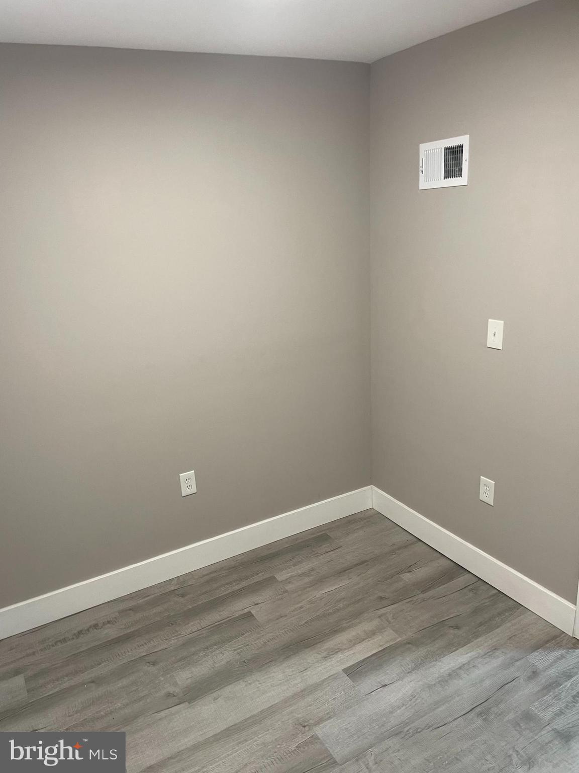 3137 Arbor Street Philadelphia, PA 19134 - Photo 14 of 17 a view of an empty room with wooden floor