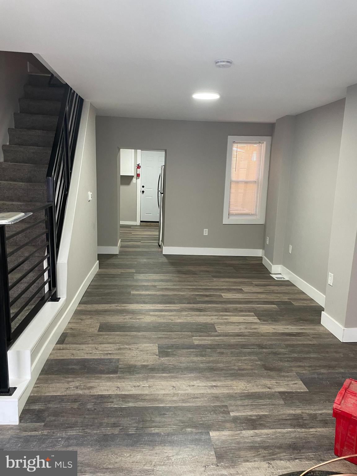 3137 Arbor Street Philadelphia, PA 19134 - Photo 3 of 17 a view of a livingroom with wooden floor and stairs