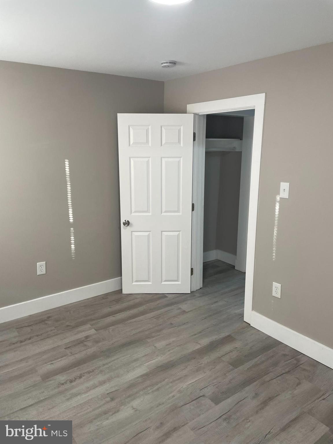 3137 Arbor Street Philadelphia, PA 19134 - Photo 7 of 17 a view of an empty room with wooden floor and closet