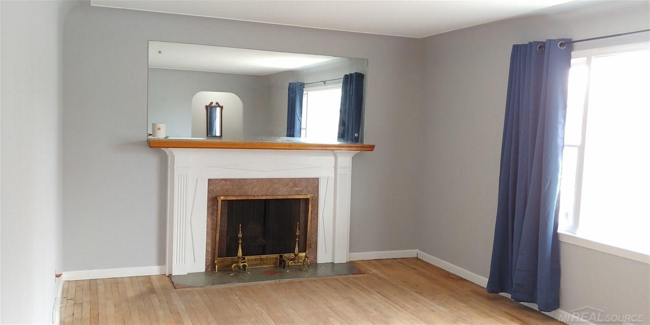 30521 Utica Road Roseville, MI 48066 - Photo 3 of 19 Light and Airy describes this massive space, perfect for entertaining or cozy nights at home with the fireplace!