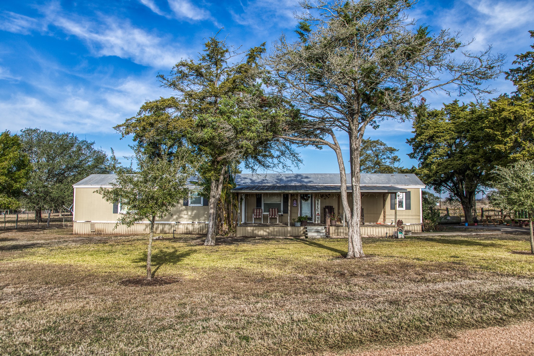 7300 Goehring Road Ledbetter, TX 78946 - Photo 13 of 21 a front view of a house with garden