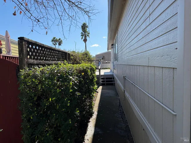 a view of a house with a flower garden