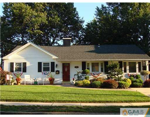 22 Baxter Road Edison, NJ 08817 - Photo 1 of 17 a front view of a house with garden