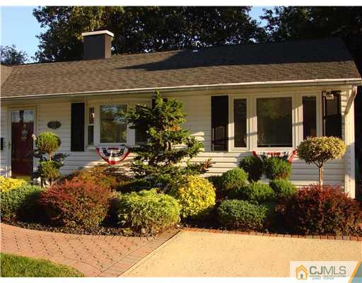 22 Baxter Road Edison, NJ 08817 - Photo 2 of 17 a view of a house with a flower garden
