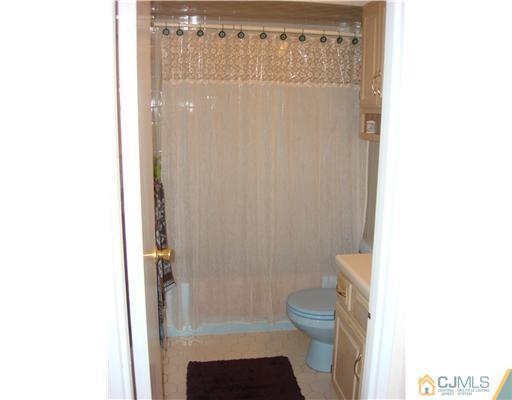 22 Baxter Road Edison, NJ 08817 - Photo 11 of 17 a bathroom with a toilet and a shower
