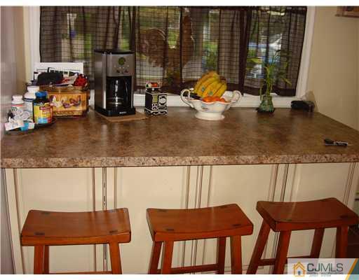 22 Baxter Road Edison, NJ 08817 - Photo 13 of 17 a view of a dining room with furniture and floor to ceiling window