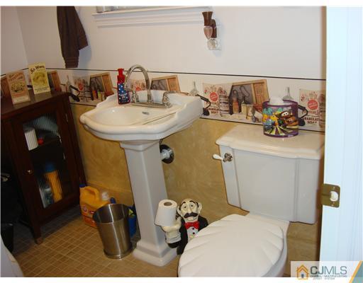 22 Baxter Road Edison, NJ 08817 - Photo 15 of 17 a bathroom with a sink and mirror