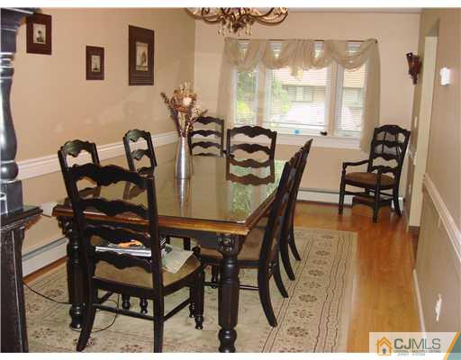 22 Baxter Road Edison, NJ 08817 - Photo 17 of 17 a dining room with furniture and wooden floor