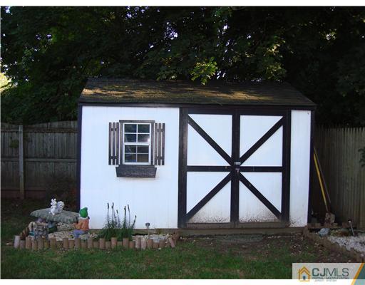 22 Baxter Road Edison, NJ 08817 - Photo 3 of 17 a view of outdoor space and barbecue grill