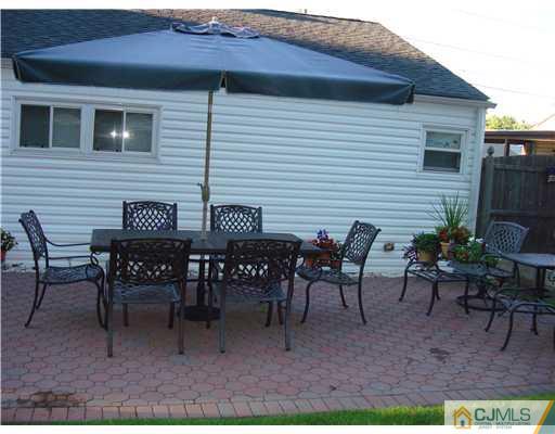 22 Baxter Road Edison, NJ 08817 - Photo 5 of 17 a view of a house with a backyard and sitting area