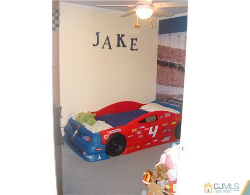 22 Baxter Road Edison, NJ 08817 - Photo 10 of 17 a bedroom with a bed and a view of bathroom