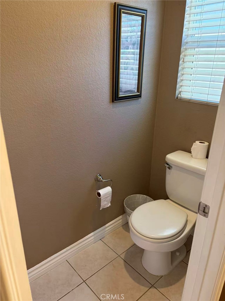 11090 Mountain View Drive, Unit 71 Rancho Cucamonga, CA 91730 - Photo 11 of 24 a white toilet sitting next to a window