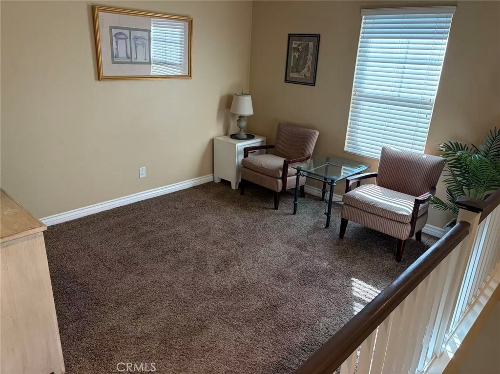 11090 Mountain View Drive, Unit 71 Rancho Cucamonga, CA 91730 - Photo 20 of 24 a living room with furniture and a window