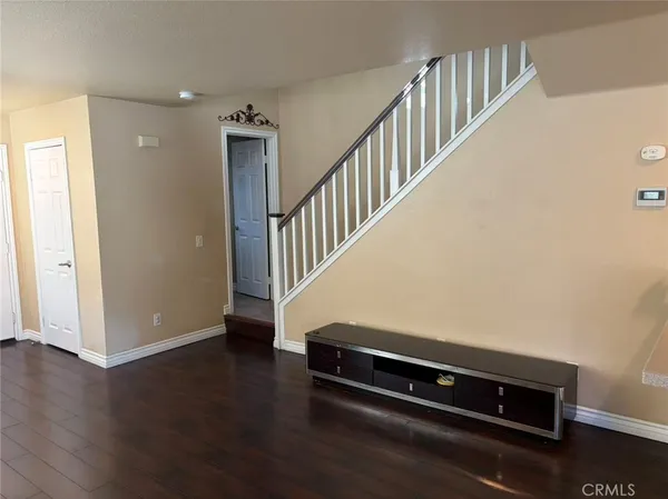 a view of entryway with wooden floor