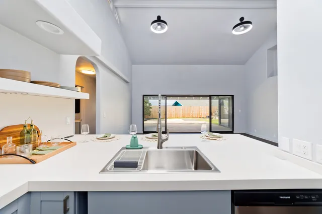 a bathroom with a sink and a window