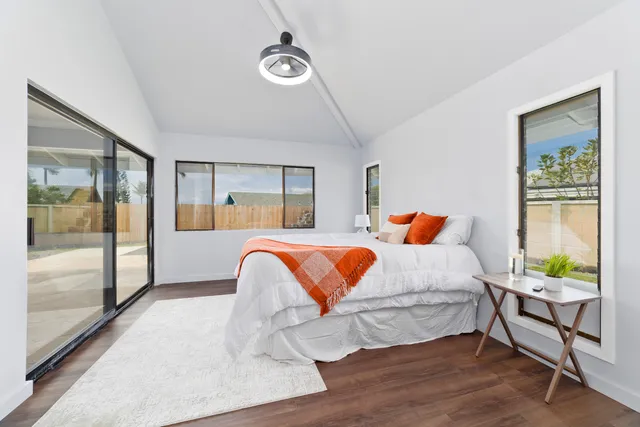 a bedroom with a bed and window