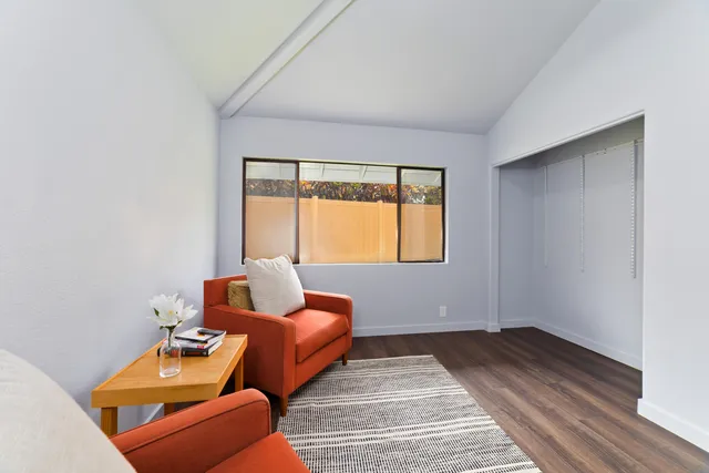 a bedroom with furniture and a window