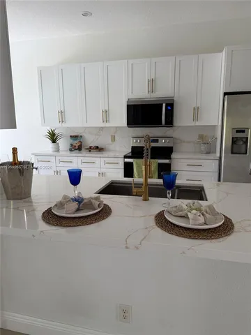 a bathroom with a toilet a sink and bathtub