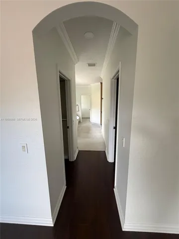 a bathroom with a shower and a sink