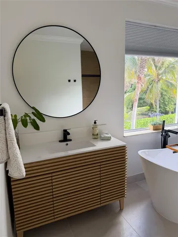 a view of an empty room and wooden floor