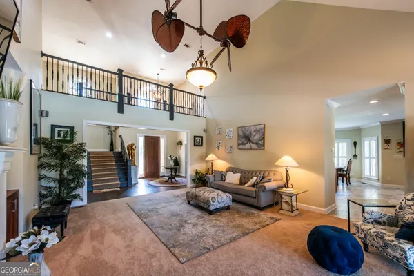 a living room with furniture a chandelier