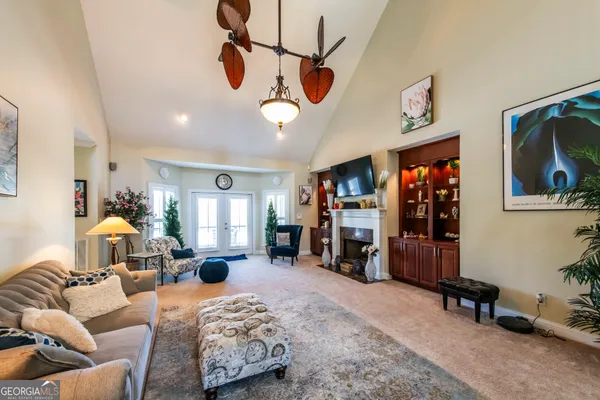 a bedroom with furniture and a chandelier