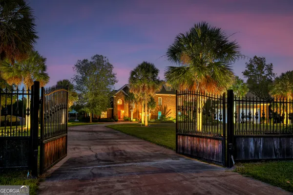 a view of a yard with a house in the background